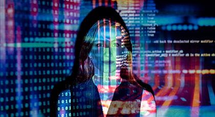 code projected over woman
